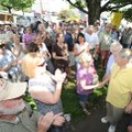  Dr. William F. Harrison, right, is greeted by a crowd of nearly 100 in front of his Fayetteville cl...
