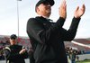 Bentonville coach Barry Lunney applauds his Tigers after defeating Fort Smith Southside in the Class 7A State Championship Game on Dec. 6, 2008, in War Memorial Stadium in Little Rock.