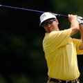 Mark Chambers of Bentonville watches his tee shot at No. 18 at Country Club Golf Course on Saturday,...