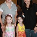 Melonie Moore, back from left, with daughter Cadence Moore, and Molly Willroth with daughter Lexie W...