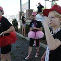 NATIONAL DANCE DAY - Emily Seiler, 13, of Rogers drinks a bottle of water Saturday after performing ...