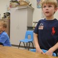 Kindergartners Nathan Nunnally, left, and Nick Plumlee learn Spanish phrases in teacher Eileen Guill...