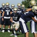 Shiloh’s Jon Hawes runs a practice drill Monday in Champions Stadium in Springdale.