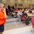 Adult Development Center Executive Director Brenda Neal weeps Monday while welcoming ADC clients to ...