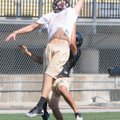 Bentonville’s Austin Molitor, left, catches a pass Wednesday during a Bentonville practice.