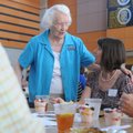Mary Mae Jones, left, who worked as a teacher in Bentonville for 42 years, talks Wednesday with Shar...