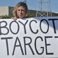 FILE — In this photo taken July 24, 2010, Laura Hedlund, 48 of Eagan, protests in front of a Target ...