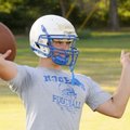 Rogers High quarterback Nick Wary lets a pass fly during practice Monday in Rogers.