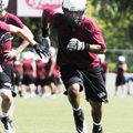 Springdale High junior receiver Kempys Robinson runs drills Monday during preseason practice.