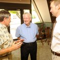 Longtime optometrist Dr. Robert Martin, center, speaks Wednesday with optometrist John Vanderbush, r...