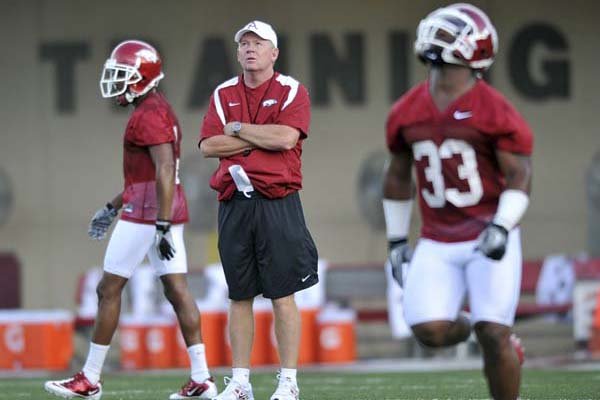 arkansas-coach-bobby-petrino-watches-dennis-johnson-33-during-early-drills-in-the-razorbacks-first-practice-thursday-in-fayetteville