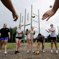 LEARNING THE ROPES - The Springdale High volleyball team works on a concentration game during a team...
