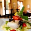 Petit Bistro’s popular Escolar Puttanesca is served with grilled asparagus and basmati saffron rice ...