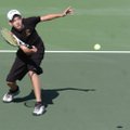 Bentonville’s Zach Ellis returns a volley in the doubles championship match on Oct. 20 in the Class ...