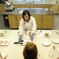TYSON FOODS - Alisha Parson, food technologist with Tyson, serves samples of a low-sodium pork chop ...