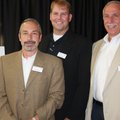 United Way board members Rick Sorrell, from left, Don Devine and Dick Levin welcome guests to breakf...