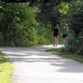 PATHWAYS A PRIORITY - Robyn Taylor, left, and Lynn Wheeler walk along the trail Friday at J.B. Hunt ...