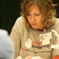 Lois Coulter of Springdale, a faculty member at the UAMS College of Pharmacy, draws a blood sample S...