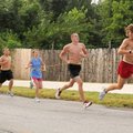 Rogers High cross country team members Drew Storment, from the right, Brett Elam, Emily Weeden, Jaro...