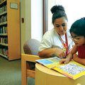 Alma Marta beats the heat Sunday with daughter Fabiola Marta, 8, by doing activities at the Springda...