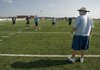 Springdale Har-Ber head coach Chris Wood looks over the field during the Wildcats’ first practice Monday in Springdale.