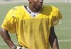 Bentonville junior DeMarcus Murphy cools off between practice sessions Tuesday in Tiger Stadium in Bentonville. Training as defensive outside linebacker and offensive running back, DeMarcus is one of the few Tigers who may play offense and defense this season.