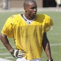 Bentonville junior DeMarcus Murphy cools off between practice sessions Tuesday in Tiger Stadium in B...