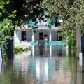 Floodwater from the South Skunk River flood neighborhoods in Colfax, Iowa, Wednesday, Aug. 11, 2010....