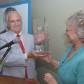 State Rep. Tim Summers receives his award Wednesday from Kathy Grisham, executive director of the Co...