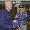 LOST MEDALS REPLACED - Retired Air Force Lt. Col. Steve Gray, left, presents medals to World War II ...