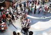 Har-Ber High School sophomores and their families line up Thursday to get their class schedules for the new school year at the school in Springdale. Hundreds of students arrived to get schedules, photo IDs, pay fines and fees and get locker assignments.
