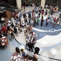 Har-Ber High School sophomores and their families line up Thursday to get their class schedules for ...