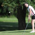 Bentonville’s Christina Johnson chips onto the green July 29 during tryouts for the Lady Tigers’ gol...