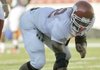 Chris Smith is among the Razorbacks freshmen who are adjusting to Division I football workouts as well as life away from home. Smith, a defensive end who is expected to contribute this season, said, “My mom makes some great pork chops. I’m missing that.”