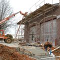 A worked finishes up cement work in front of Fire Station No. 3 on Happy Hollow Road in Fayetteville...
