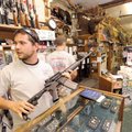 Paul Valgos, a pawn broker at Mountain Man Supplies and Pawn in Fayetteville, speaks with a co-worke...