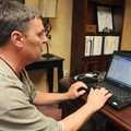 Tim Brasel, controls operator with Bentonville Public Schools, monitors an air conditioning unit Wed...