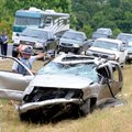 ROLLOVER - Arkansas State Trooper Jesse Woodam inspects a vehicle involved in an accident Saturday o...