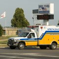 A Springdale Fire and Rescue Truck with it's lights flashing goes through the intersetion of Emma Av...