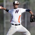 Rogers Heritage starter Hunter Wood delivers a pitch on April 13, 2010, against Bentonville at Veter...