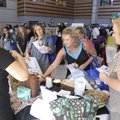 Area businesses set up Teachers’ Fair booths Monday with free goodies for teachers returning to work...