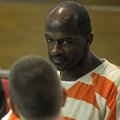 Ricky Ray Anderson talks Monday with one of his volunteer attorneys, Ray Niblock. Anderson and attor...