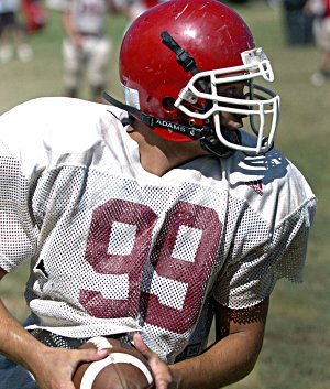 Farmington’s Jared Martin, who plays linebacker and running back for the Cardinals, turns upfield Monday during practice.