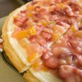 Fruit Pizza can be made with in-season fresh fruit or even canned fruit cocktail.