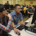 Diego Chang, second from left, helps Nicolas Nunez, an international student from La Paz, Bolivia, e...