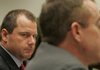  Former major league pitcher Roger Clemens looks at Brian McNamee as his former personal trainer testifies before a congressional committee in 2008.