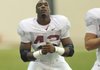 University of Arkansas linebacker Chris Smith stretches out during practice Tuesday afternoon in Fayetteville.