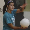 Fayetteville’s Taylor Hightower prepares to serve to Huntsville on Thursday during a match at Benton...