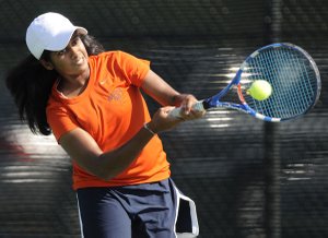  Rogers Heritage No. 1 girls player Pratheepa Ravikumar returns the ball in her singles match Thursday against Van Buren in Rogers.
