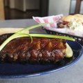  The Dink Sandwich at Dink’s World Famous Pit BBQ in Bentonville is a customer favorite and features...